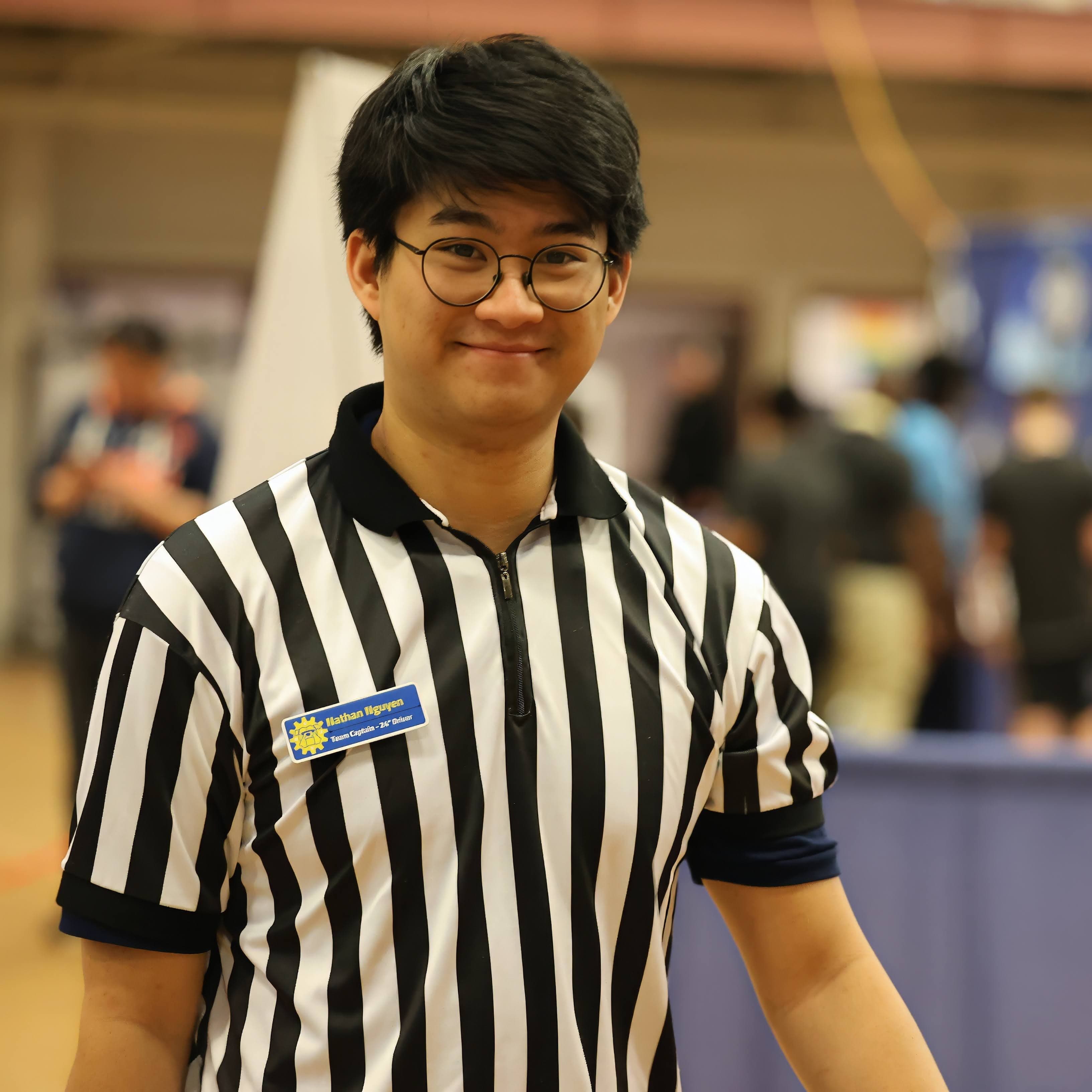 Nathan Nguyen refereeing a robotics competition